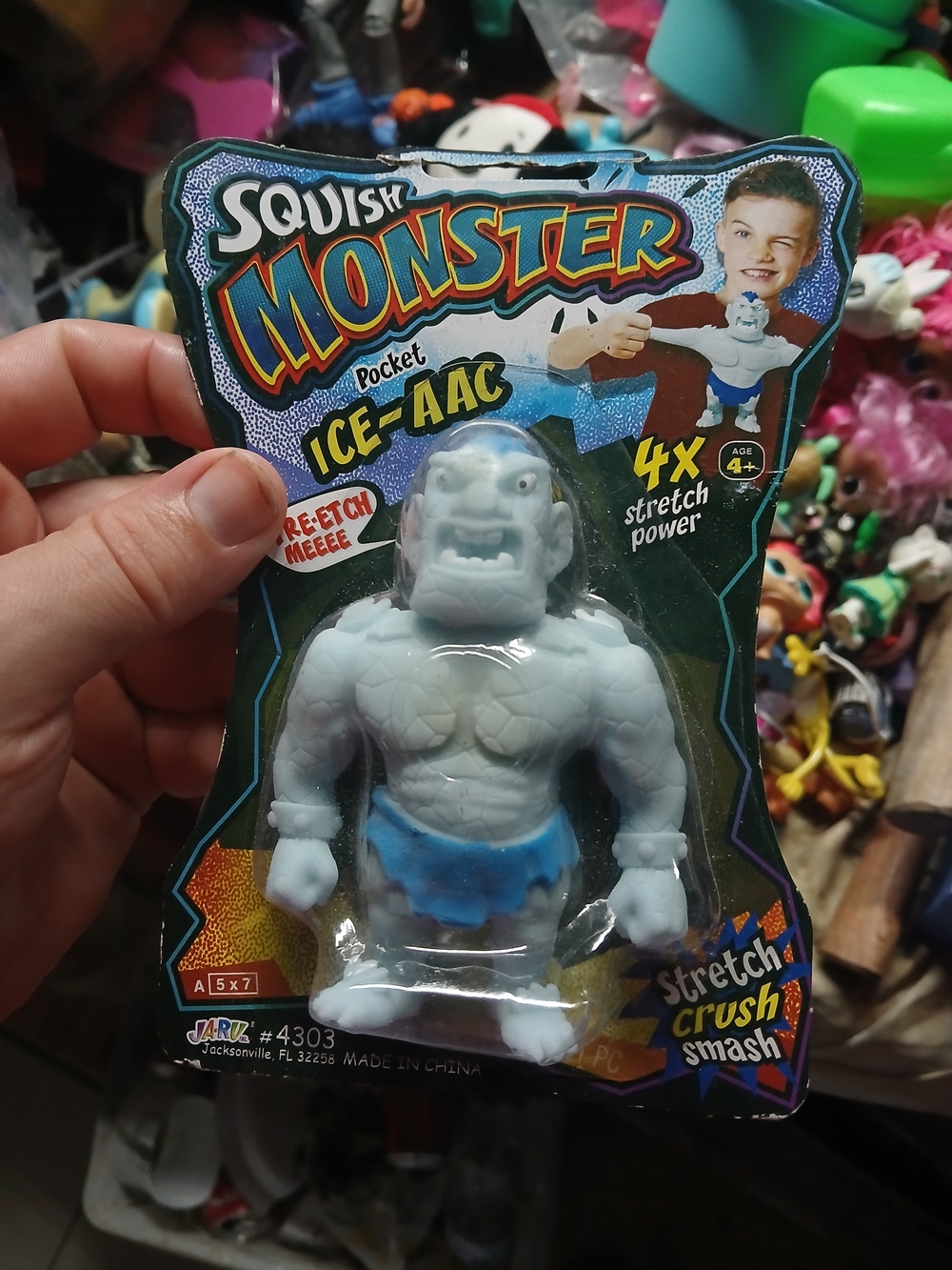 light blue Ice-Aac pocket squish monster toy figure wearing a blue loincloth.